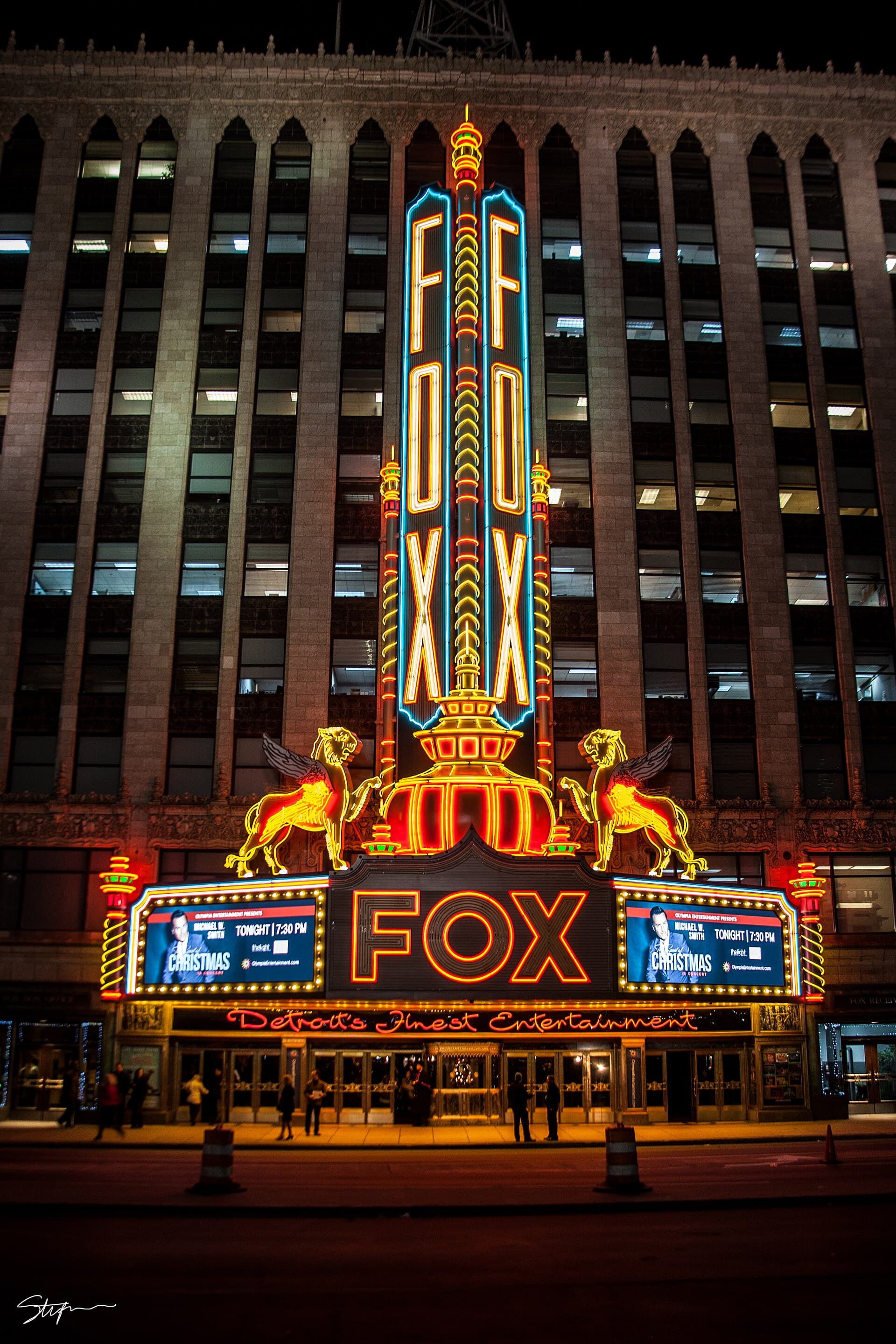 A theatre marquee lit at night